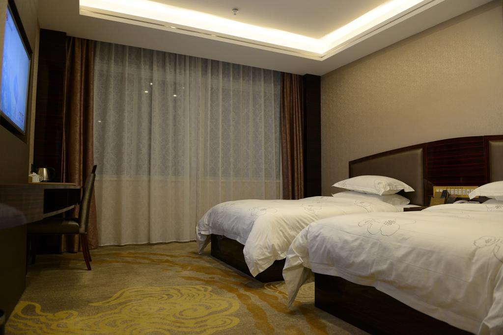 Tie Cheng Hotel Cantão Quarto foto